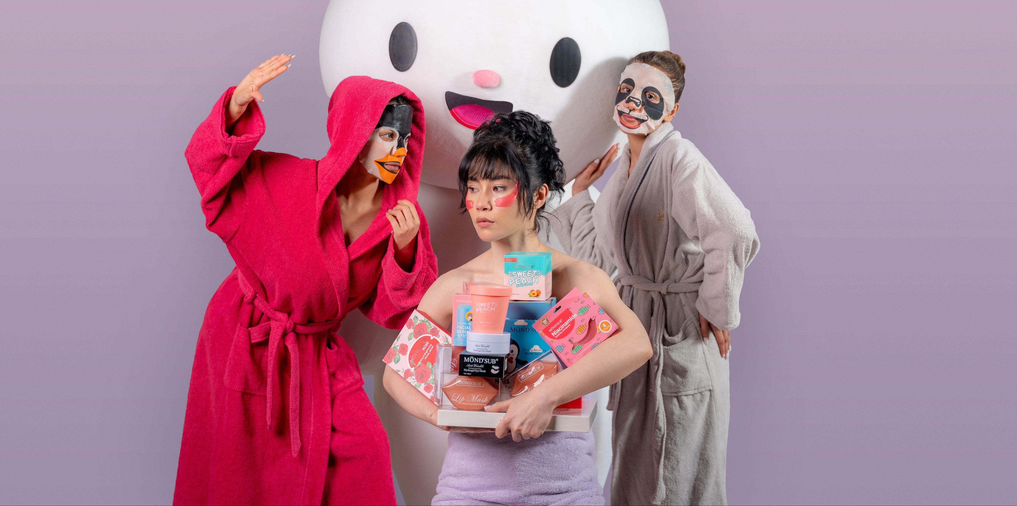 Three people in bathrobes with a large cartoon character on a purple background

